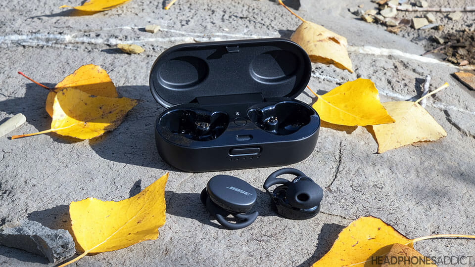 Bose Sport Earbuds on a rock