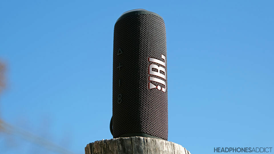 JBL Flip 6 on a wooden stick