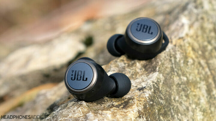 JBL Live 300TWS earbuds on rock