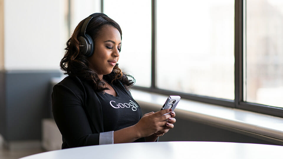 Lady listening to wireless headphones