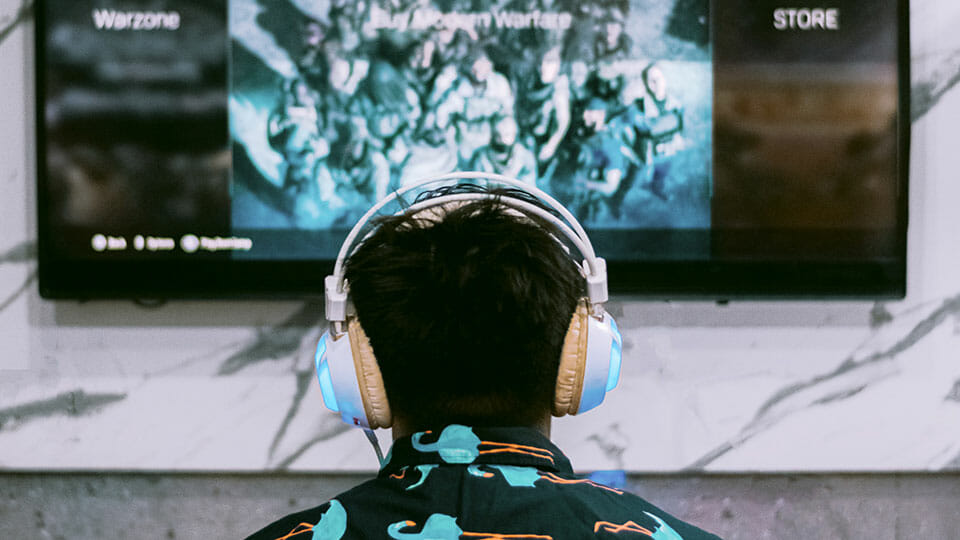 Man with headphones playing games