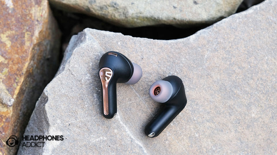 SoundPEATS Capsule3 Pro earbuds on a stone