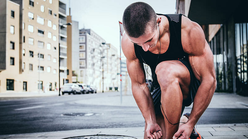 Runner tying sneakers