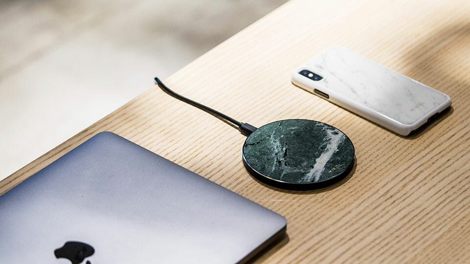 Wireless charging pad with MacBook and iPhone