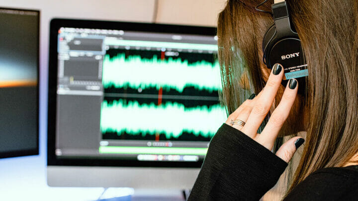 Woman in studio wearing headphones