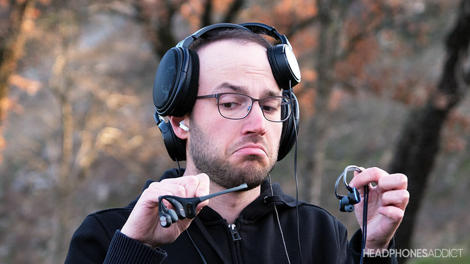 Confused man wearing headphones