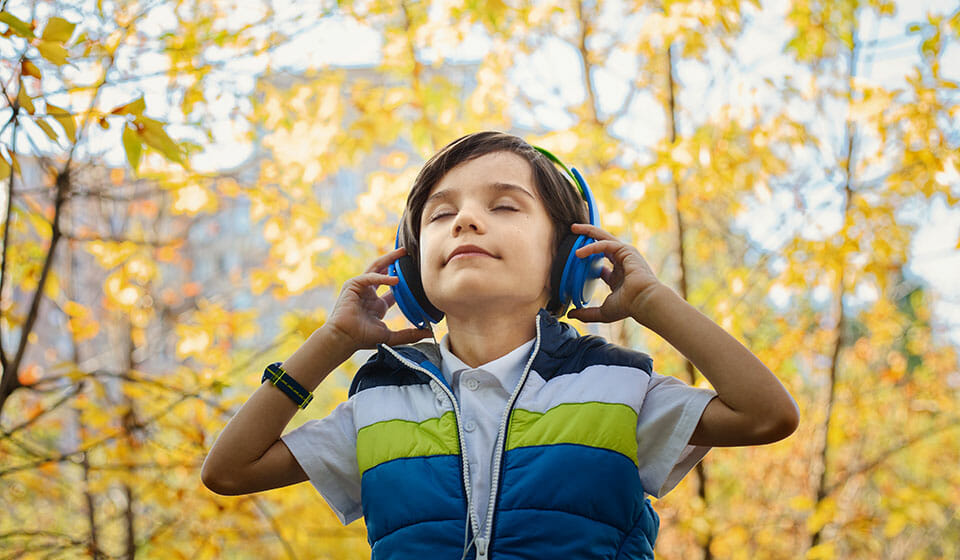 kid wearing noise isolating headphones