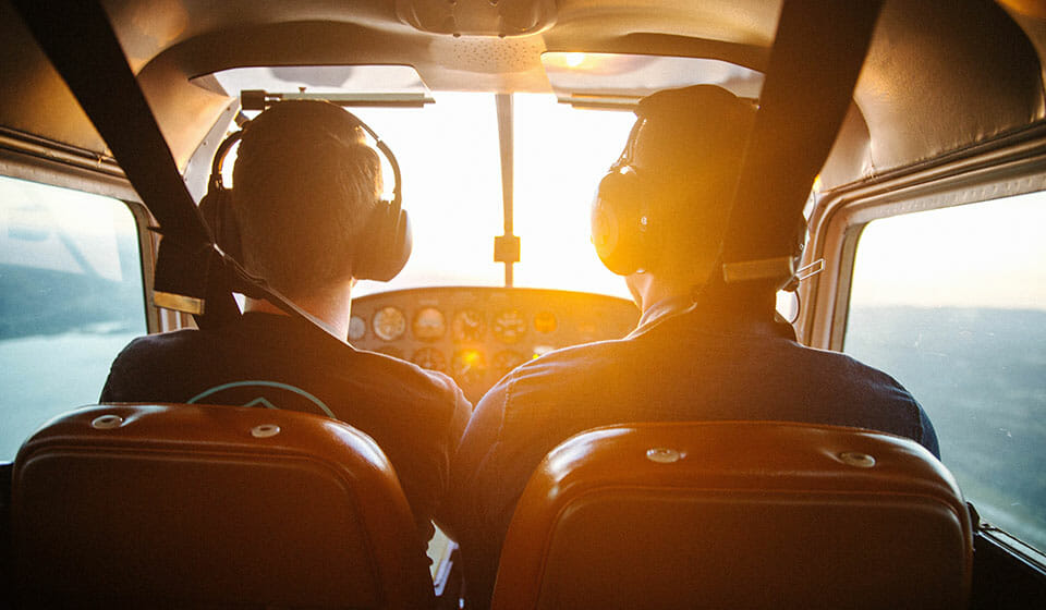 noise cancelling headphones in an airplane